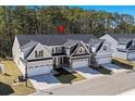 Aerial view of a well-maintained neighborhood showcasing homes with neat lawns and tree-lined streets at 115 Galil Dr. # B, Myrtle Beach, SC 29579