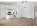 Spacious living room with light wood floors and a view into the kitchen at 1206 Cypress Shoal Dr., Conway, SC 29526