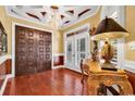 Beautiful foyer featuring hardwood floors, chandelier, and striking wood door at 1341 Waterway Dr., North Myrtle Beach, SC 29582
