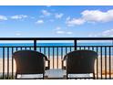 Relax on this balcony with chairs and enjoy the view of the ocean and beach at 1501 S Ocean Blvd. # 633, Myrtle Beach, SC 29577