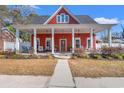 Charming two-story home with a welcoming porch adorned with ceiling fans and ample seating at 1608 25Th Ave. N, North Myrtle Beach, SC 29582