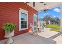 Inviting porch features comfortable seating, decorative plants, and stylish ceiling fans at 1608 25Th Ave. N, North Myrtle Beach, SC 29582