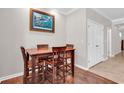 Dining room with a wooden table set, hardwood floors, and neutral wall paint at 1749 Culbertson Ave. # 1749, Myrtle Beach, SC 29577