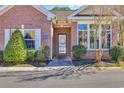 Charming front entrance with brick facade and well-maintained landscaping at 2019 Balfour Ct. # L4, Myrtle Beach, SC 29575