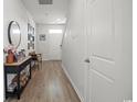 Bright foyer with wood-look floors, leading to the upper level with a side door at 283 Marauder Dr., Longs, SC 29568
