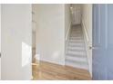 Bright foyer featuring hardwood floors, stairway, and a glimpse into the home's interior at 3936 Tybre Downs Circle # 3936, Little River, SC 29566