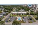 Aerial view of condo complex with pool and parking in a suburban setting near the beach at 405 21St Ave. S # 1-O, North Myrtle Beach, SC 29582