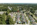 Neighborhood aerial view shows proximity to nearby amenities and a lush green landscape at 4856 Bermuda Way N, Myrtle Beach, SC 29577