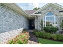 Inviting entryway with brick walkway and vibrant flower beds that enhance the curb appeal at 4856 Bermuda Way N, Myrtle Beach, SC 29577