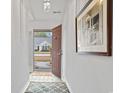 Inviting foyer with light tile flooring, neutral walls, and an open doorway at 5077 Capulet Circle, Myrtle Beach, SC 29588