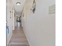 Hallway with wood-look floors leading to living area at 510 Fairwood Lakes Ln. # 20E, Myrtle Beach, SC 29588