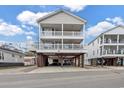 Charming raised beach house with ample parking and storage underneath, showcasing its coastal architecture at 6001-N50 S Kings Hwy., Myrtle Beach, SC 29575