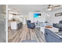 Bright living room features modern furniture, a large TV, and stylish decor at 6001-N50 S Kings Hwy., Myrtle Beach, SC 29575