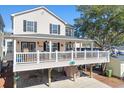 A beautiful beach home with a large front porch, offering a relaxing outdoor space at 6001-Z-26 South Kings Hwy., Myrtle Beach, SC 29575