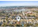 Aerial view of a neighborhood, with this house marked by a pin, close to stores and a distant ocean at 606 5Th Ave. S, North Myrtle Beach, SC 29582