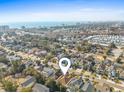 Aerial view of a coastal neighborhood, with this house marked by a pin, near the beach and hotels at 606 5Th Ave. S, North Myrtle Beach, SC 29582