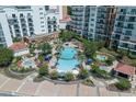 Aerial view of the luxurious pool and lounge area with ample seating and lush landscaping at 8121 Amalfi Pl. # 4306, Myrtle Beach, SC 29572