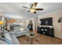 Comfortable living room with a fireplace, TV, and view into the dining area at 813 Silvercrest Dr., Myrtle Beach, SC 29579