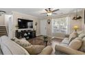 Cozy living room featuring a large window, plush sofas, and modern decor at 813 Silvercrest Dr., Myrtle Beach, SC 29579