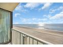 Balcony view with oceanfront views of the beach from a high-rise condo with railings at 9400 Shore Dr. # 722, Myrtle Beach, SC 29572