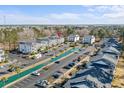 Community aerial view with a long water feature, parking, and multiple condo buildings at 1282 River Oaks Dr. # 9F, Myrtle Beach, SC 29579