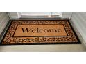 Welcoming doormat with decorative border at 1407 Gooseneck Place # 202, Murrells Inlet, SC 29576