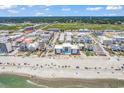 Expansive aerial view of the beach and condo building with inland waterways in the distance at 200 N Waccamaw Dr. # 3F, Murrells Inlet, SC 29576