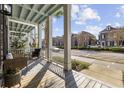 Charming porch view showcases seating area and a glimpse of the neighborhood at 2794 Howard Ave. # D, Myrtle Beach, SC 29577