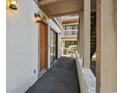 A cozy condominium entrance featuring a door and sliding glass door, leading to the interior of the residence at 306 74Th Ave. N # 105, Myrtle Beach, SC 29572