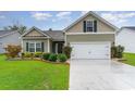 Charming single-Gathering home featuring a well-manicured lawn and a two-car garage at 342 Palm Terrace Loop, Conway, SC 29526