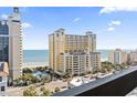 Balcony view of an oceanfront building with palm trees lining the street at 400 20Th Ave. N # 1101, Myrtle Beach, SC 29577