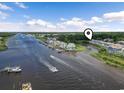 Wide angle aerial shot of condo community on the waterway with multiple boat docks at 4405 Eastport Blvd. # D-8, Little River, SC 29566