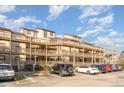 Exterior view of building featuring multiple stories, balconies, and convenient parking at 501 Maison Dr. # E20, Myrtle Beach, SC 29572