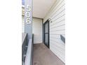 The entrance to the unit has unit number and a light fixture at 4350 Spa Dr. # 506, Little River, SC 29566