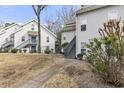 View of the exterior of residential building with a light gray facade and staircases at 4350 Spa Dr. # 506, Little River, SC 29566
