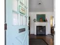 View from the entry featuring a fireplace, a decorative rug, and hardwood floors at 632 Magnolia Dr., Georgetown, SC 29440