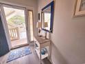 Bright entryway features coastal decor and a glimpse of the outdoor balcony at 1058 Sea Mountain Hwy. # 14-203, North Myrtle Beach, SC 29582