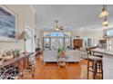 Bright and airy living room with hardwood floors, plush seating, and French doors leading to the outside at 1606 Lake Egret Dr., North Myrtle Beach, SC 29582