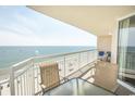 This balcony offers a stunning ocean view with comfortable seating at 1625 S Ocean Blvd. # 1109, North Myrtle Beach, SC 29582
