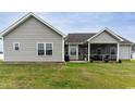 Spacious backyard featuring a cozy screened porch, blending indoor and outdoor living at 206 Marley Ct., Conway, SC 29526