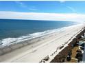 Scenic beach view with waves gently rolling onto the sandy shore at 2201 S Ocean Blvd. # 1603, Myrtle Beach, SC 29577