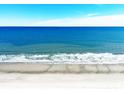 Stunning beach view featuring white sand and clear blue water on a sunny day at 2201 S Ocean Blvd. # 1603, Myrtle Beach, SC 29577