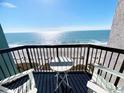 Charming balcony with chairs offering breathtaking ocean views, perfect for relaxing and enjoying the sea breeze at 2401 S Ocean Blvd. # 852, Myrtle Beach, SC 29572