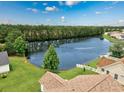 Scenic aerial view of a tranquil pond surrounded by lush greenery and residential homes at 286 Bonnie Bridge Circle, Myrtle Beach, SC 29579