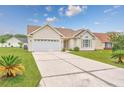 Inviting one-story home with a well-manicured lawn and a spacious driveway leading to a two-car garage at 286 Bonnie Bridge Circle, Myrtle Beach, SC 29579