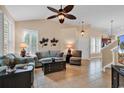 Bright living room featuring neutral walls, tile floors, and comfortable furnishings with a ceiling fan at 307 River Rock Ln. # 906, Murrells Inlet, SC 29576