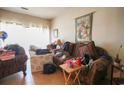 Cozy living room with bright window, comfortable seating, and decor at 312 73Rd Ave. N # 15, Myrtle Beach, SC 29572