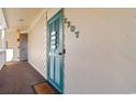 Exterior entryway showcasing a turquoise louvered door with unit number at 4350 Intercoastal Dr. # 2207, Little River, SC 29566