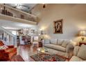 Cozy living room with hardwood floors, a vaulted ceiling, and access to the kitchen at 592 Riverward Dr. # 592, Myrtle Beach, SC 29588