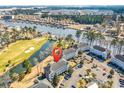 An aerial view of the condo complex, highlighting its proximity to the golf course and lakeside setting at 699 Riverwalk Dr. # 202, Myrtle Beach, SC 29579